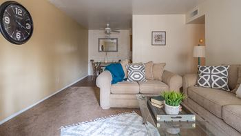 Cantera Living room with couches and carpet flooring 